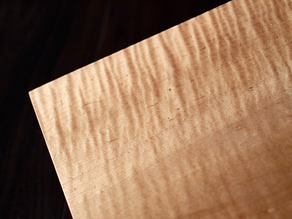 Refurbished, re-carved violin necks, curly maple. 13" x 14 1/4" x 10”