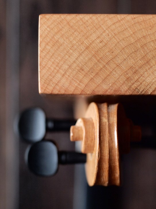 Refurbished, re-carved violin necks, curly maple. 13" x 14 1/4" x 10”