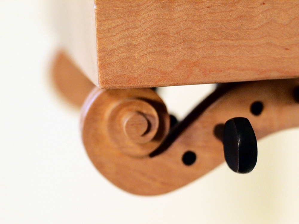 Refurbished, re-carved violin necks, curly maple. 13" x 14 1/4" x 10”