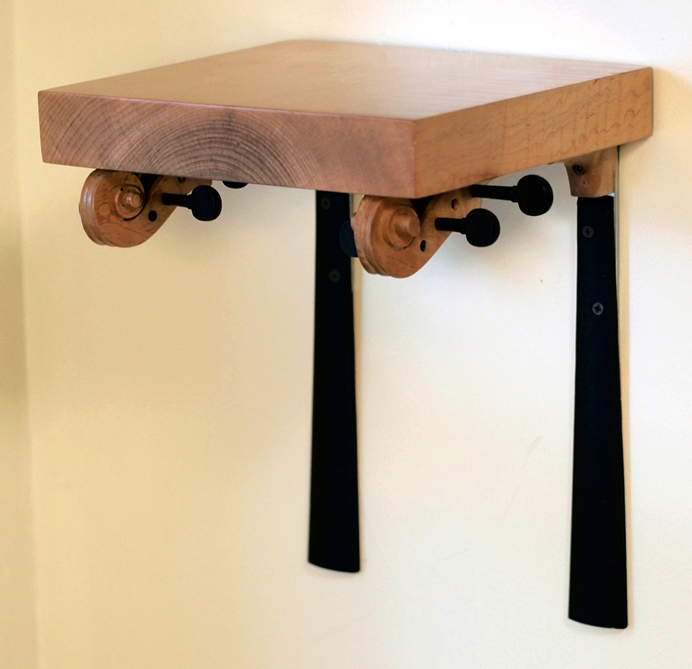 Refurbished, re-carved violin necks, curly maple. 13" x 14 1/4" x 10”