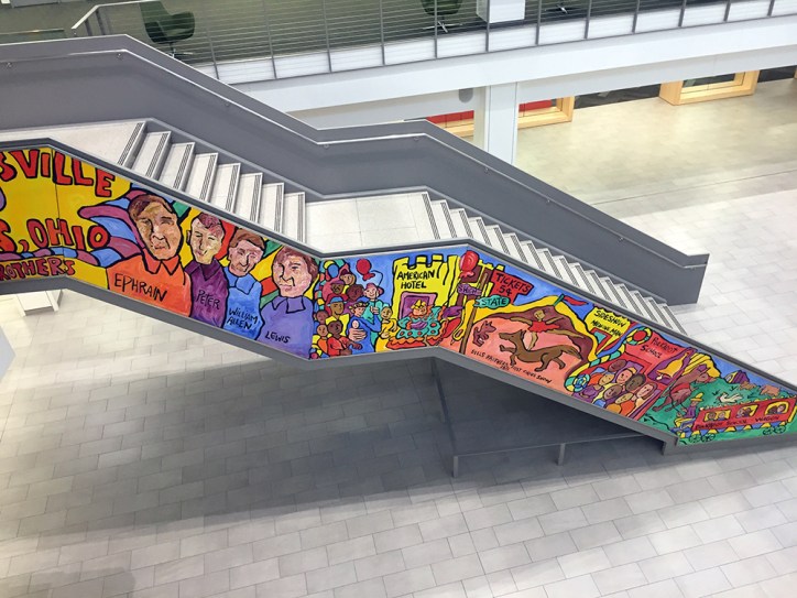 Amina Robinson's painting on the staircase of the Columbus Metropolitan Library