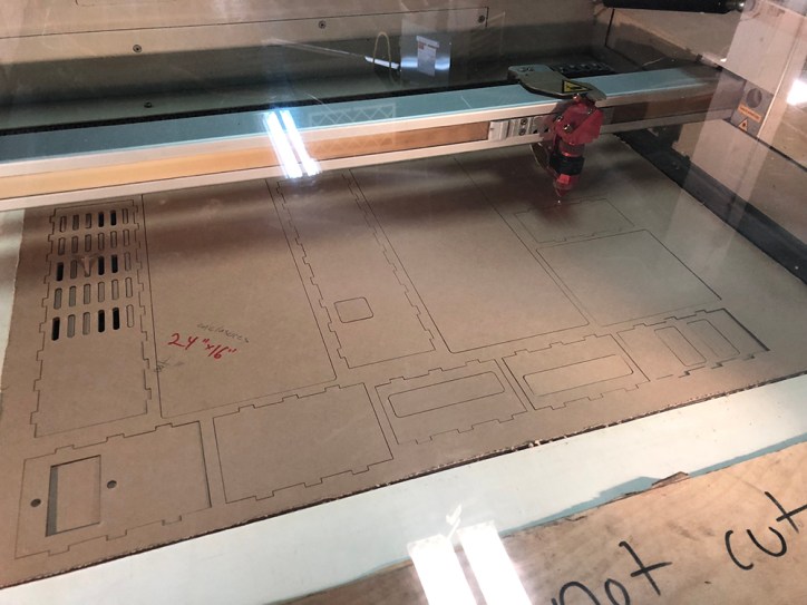 Laser cutting parts for the circuit board enclosures. Some needed redesigned, others were fine.