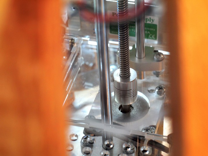 View of the stepper motor, shaft coupler, and lead screw that move the whole top up/down.