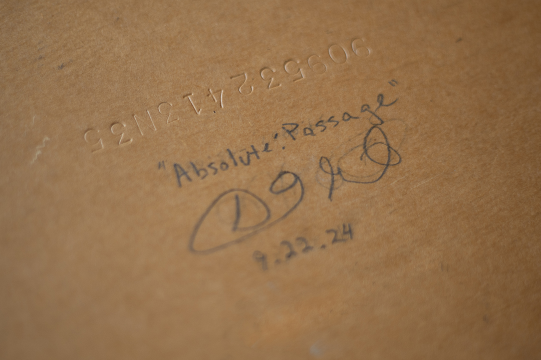 Cataloguing number, title, date, and signature of artist, Daric Gill, on the back of a painting